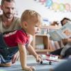 Infant crawling in a toddler class