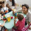 Young children and teacher at a table