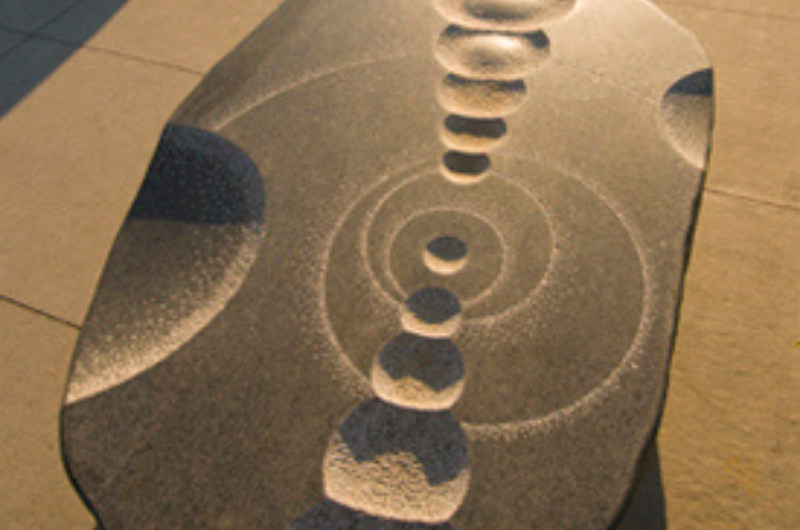 Carved granite sculpture that doubles as seating