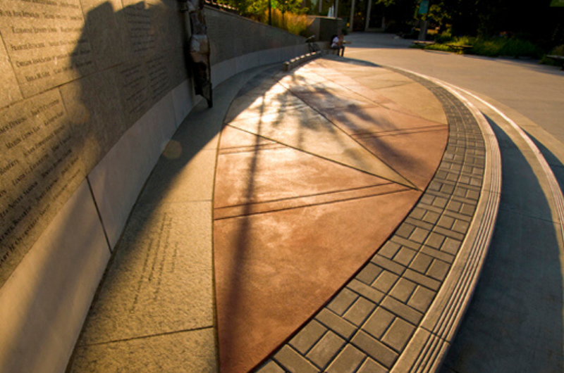 Curved stone wall and stage