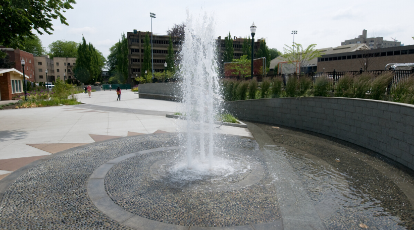 Water fountain on stone walkway