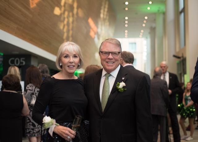 Peter and Julie Stott pose at a gala