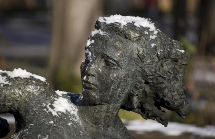 Orpheus statue with snowfall