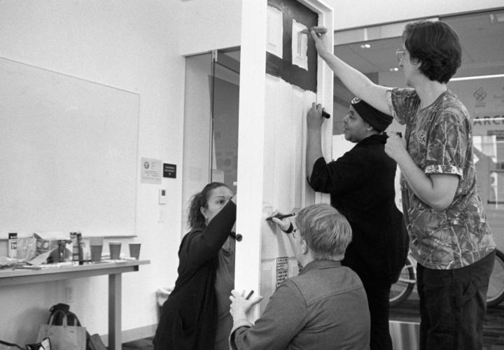 TREES members painting a door for an interpretive art project