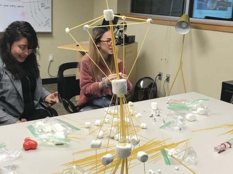 PSU honors students working on a model in the Honors Commons