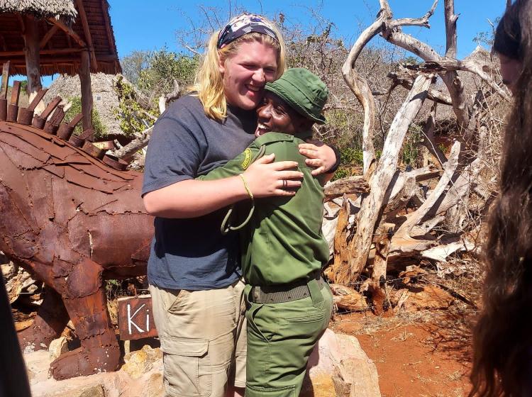 Don hugging Kenyan ranger
