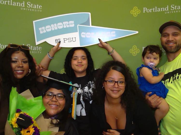 Honors College Graduates with flag