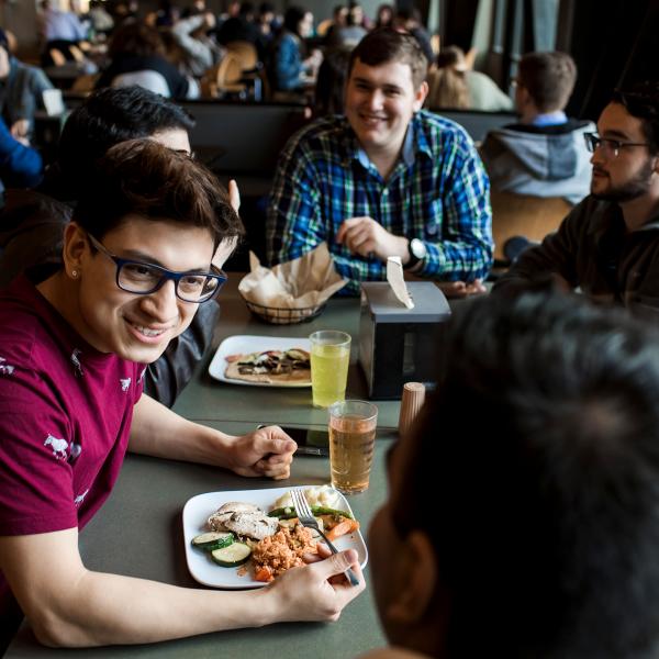 Students sharing a meal in Victor's Dining Hall