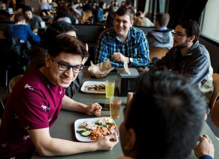 Students sharing a meal in Victor's Dining Hall