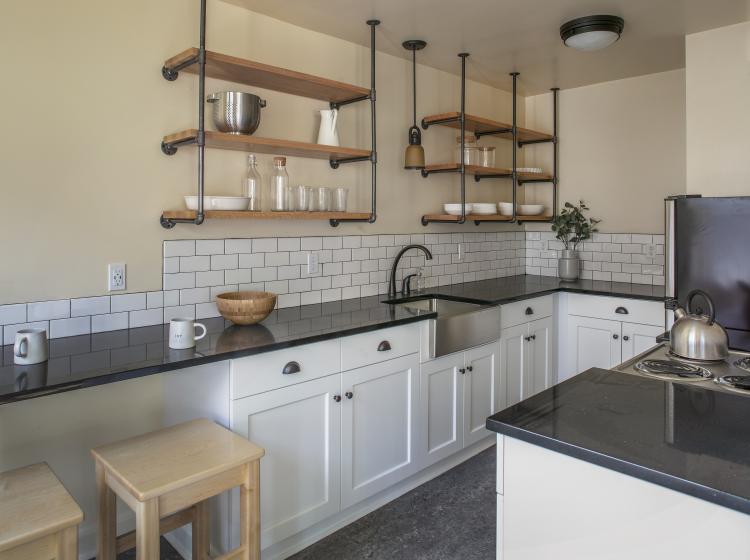 eat-in kitchen furnished with two barstools