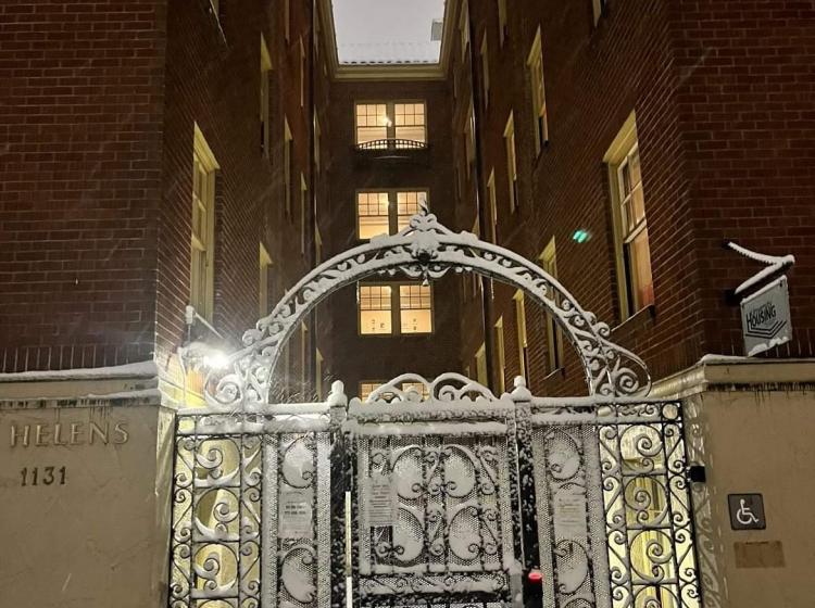 Snow covered front gate of St Helens Residence Hall