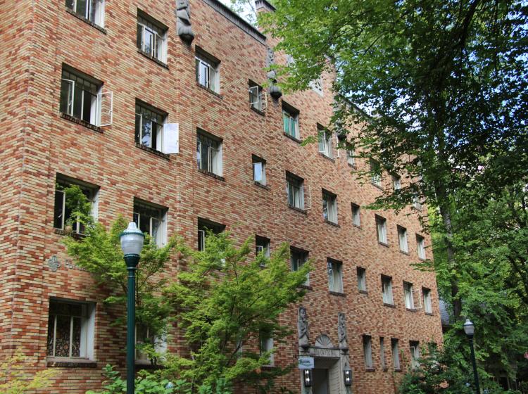 Exterior image of Blackstone - a brick building with green trees outside