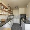 Kitchen has full-size stainless steel appliances