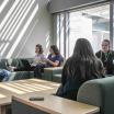 Students sitting studying in lounge in Broadway Hall