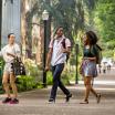Three students walking in park blocks