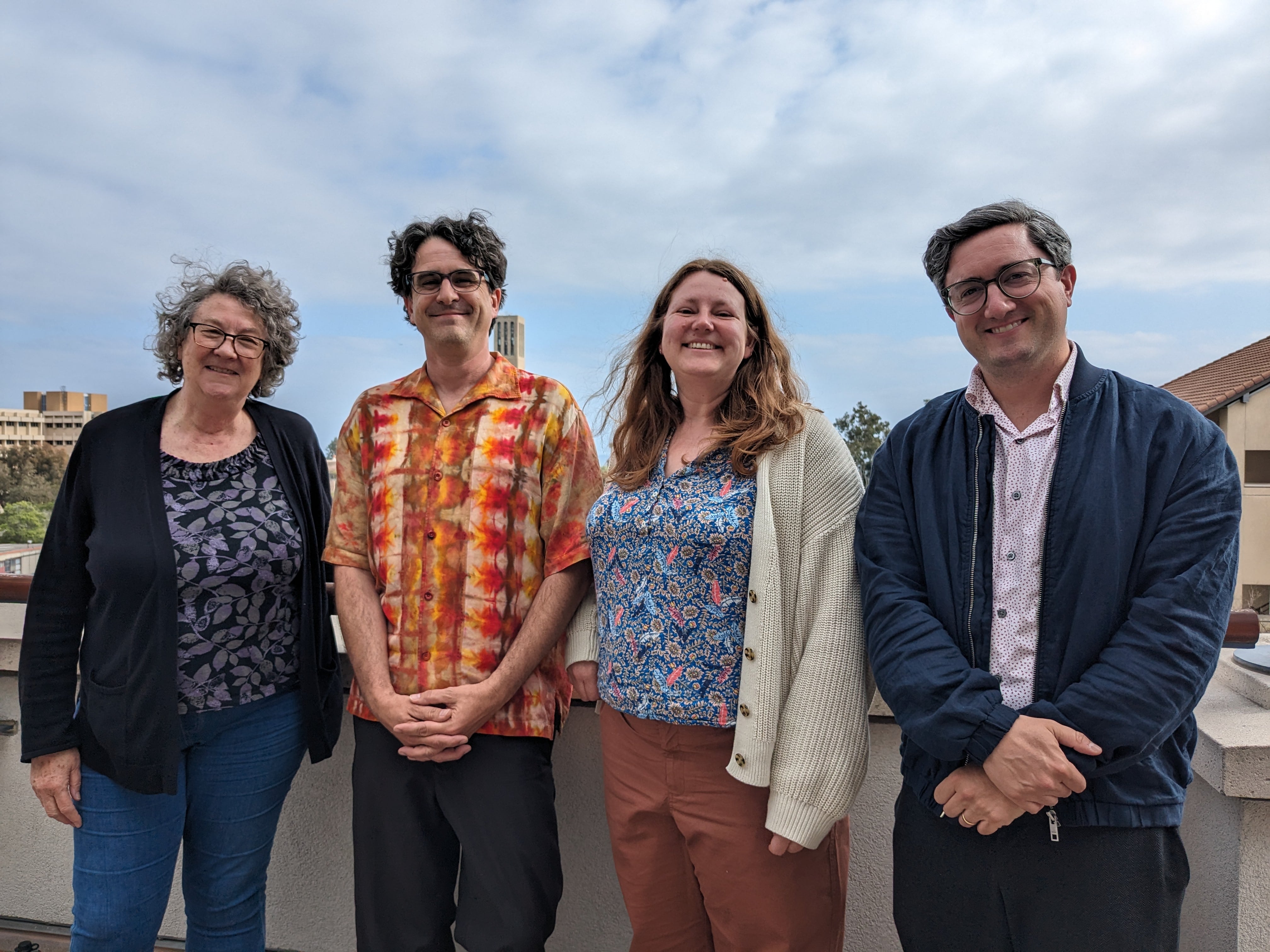 4 people standing together as part of the project's research team