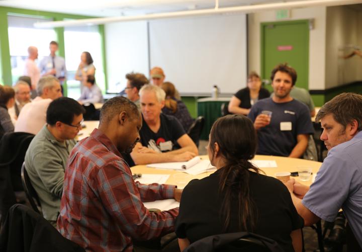 USGS and PSU researchers at a round table discuss their research.