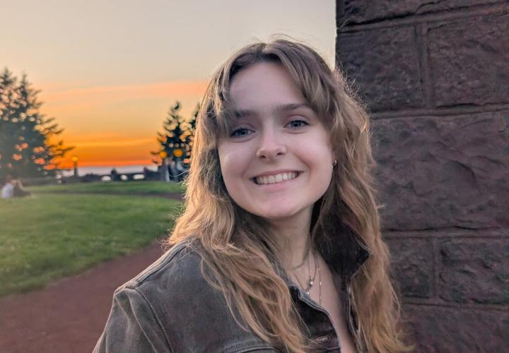 Jacquelyn Oetterer, outdoors at sunset.