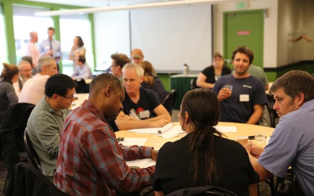 USGS and PSU researchers at a round table discuss their research.