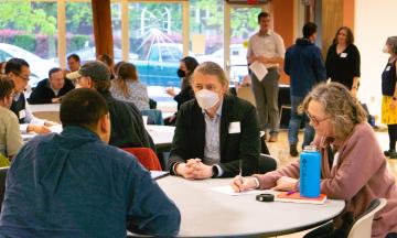 Another photo of USGS & PSU Professors Discussing at round tables