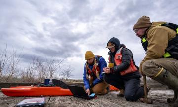 Hydro tech guides training participants as they set up the ACDP software