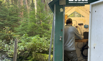 Photo: USGS hydrologic technician uses a ruler called a gravelometer to classify streambed particles into size classes. These data can be used to calibrate models of streambed sediment.  (Credit: USGS ORWSC)