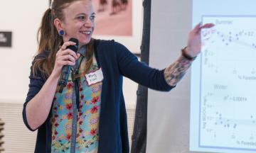 Student Mary Munt points at her data displayed on a projection screen.