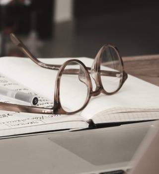 Glasses on notebook