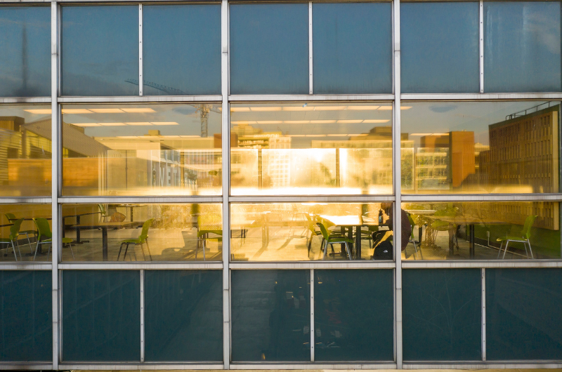 View of classroom through window from outside