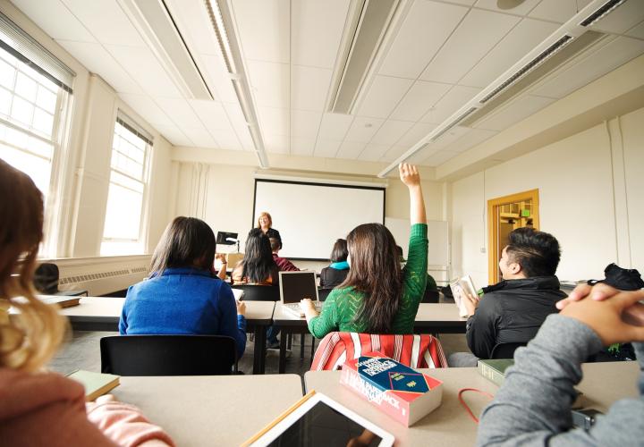 Teacher at front of classroom
