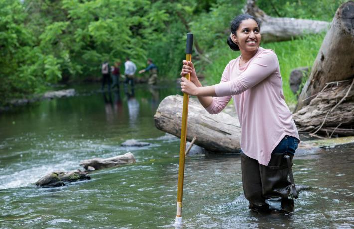 female researcher in stream