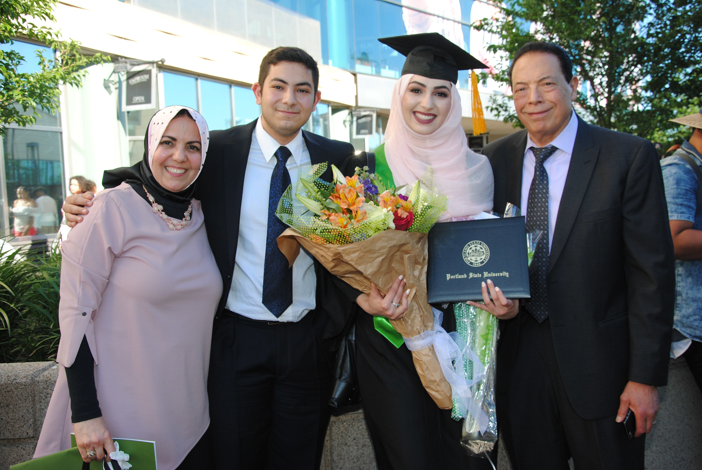 International student graduate celebrating with family members