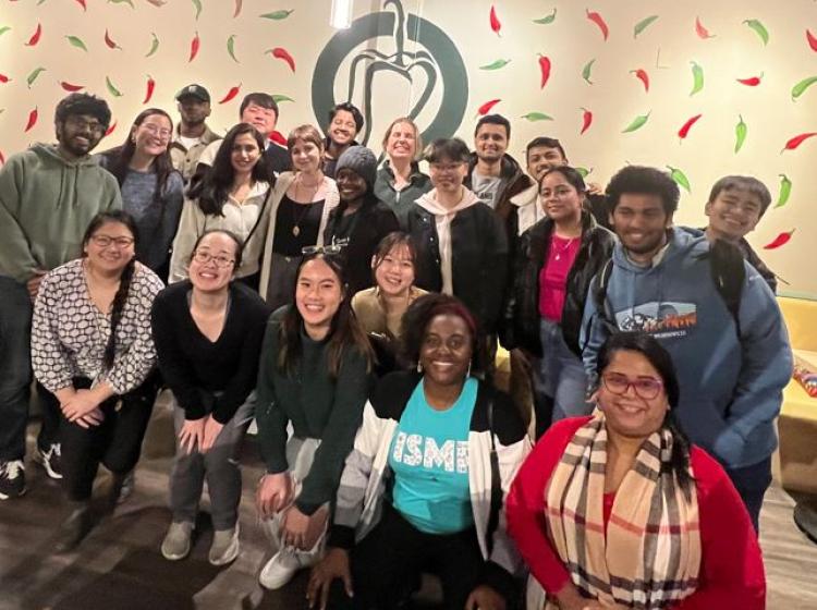 Large group of mentors standing together looking at at the camera for a photo.