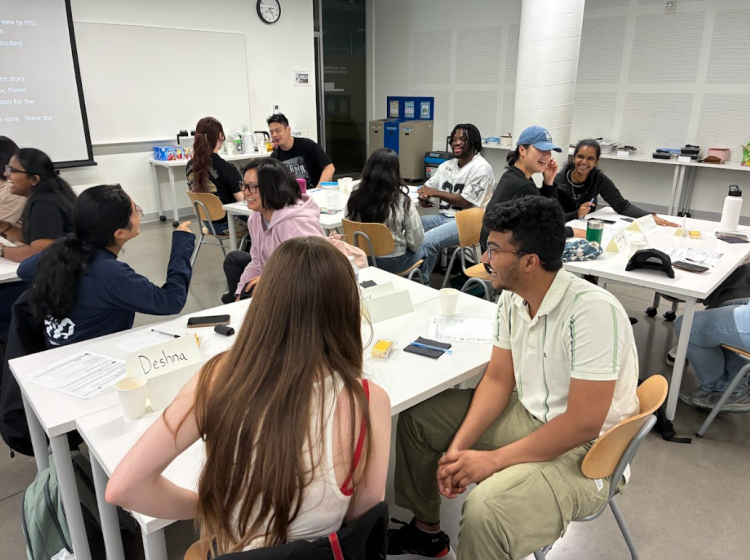 Students work in pairs in a classroom.
