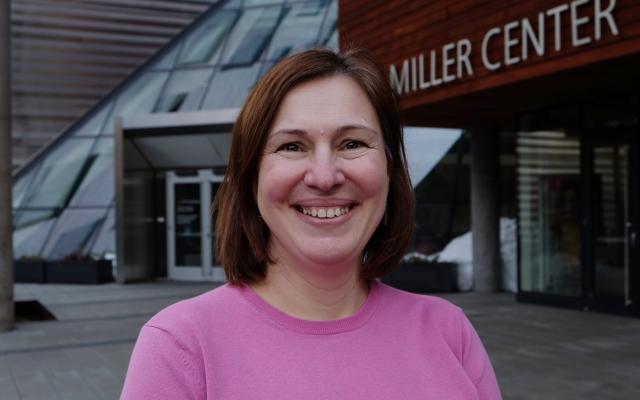 Immigration advisor Csendi Hopp in front of the Karl Miller Center