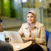 Woman sitting in front of computer