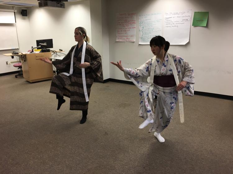 two performers dancing during rehearsal