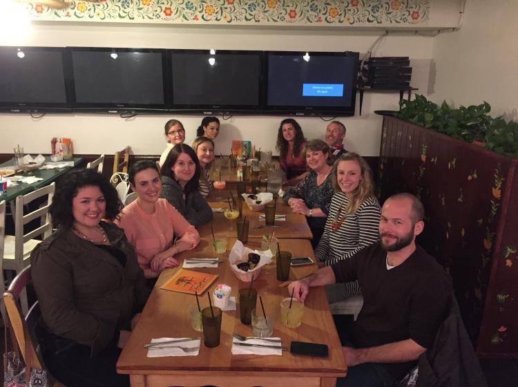 Photo of a group of PSU social psychology faculty and students sitting around a dinner table at a restaurant during a dinner at SPSP 2016.