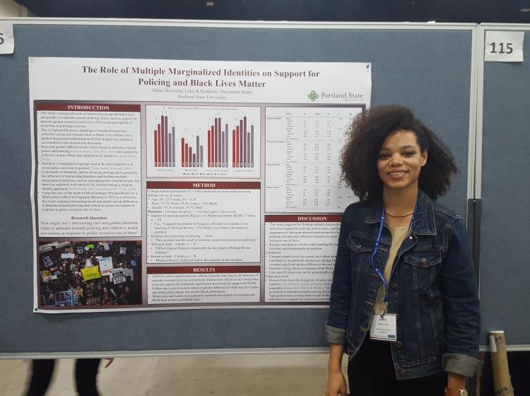 Jaboa Lake standing in front of her poster for SPSP 2017. The poster is titled: "The Role of Multiple Marginalized Identities on Support for Policing and Black Lives Matter"