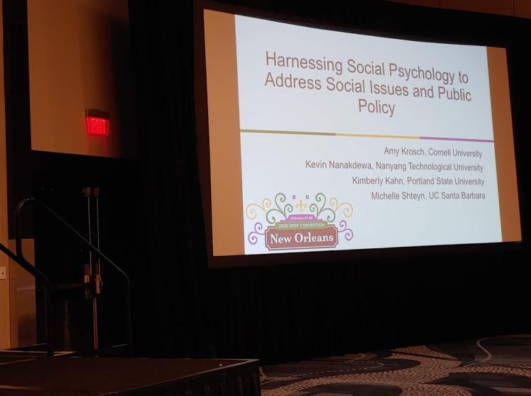 Photo of the introduction slide for a symposium that Dr. Kahn was a speaker on at the SPSP 2020 annual conference. The title of the symposium is: "Harnessing Social Psychology to Address Social Issues and Public Policy"