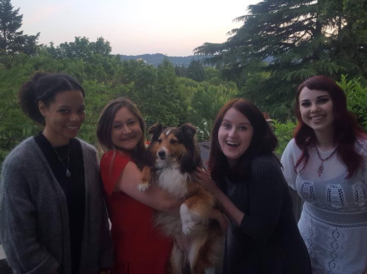 GRASP Lab members in June of 2018 standing side by side in front of a forested background. From left to right: Jaboa Lake, Kimberly Kahn holding her sheltie, Jean McMahon, Emma Money