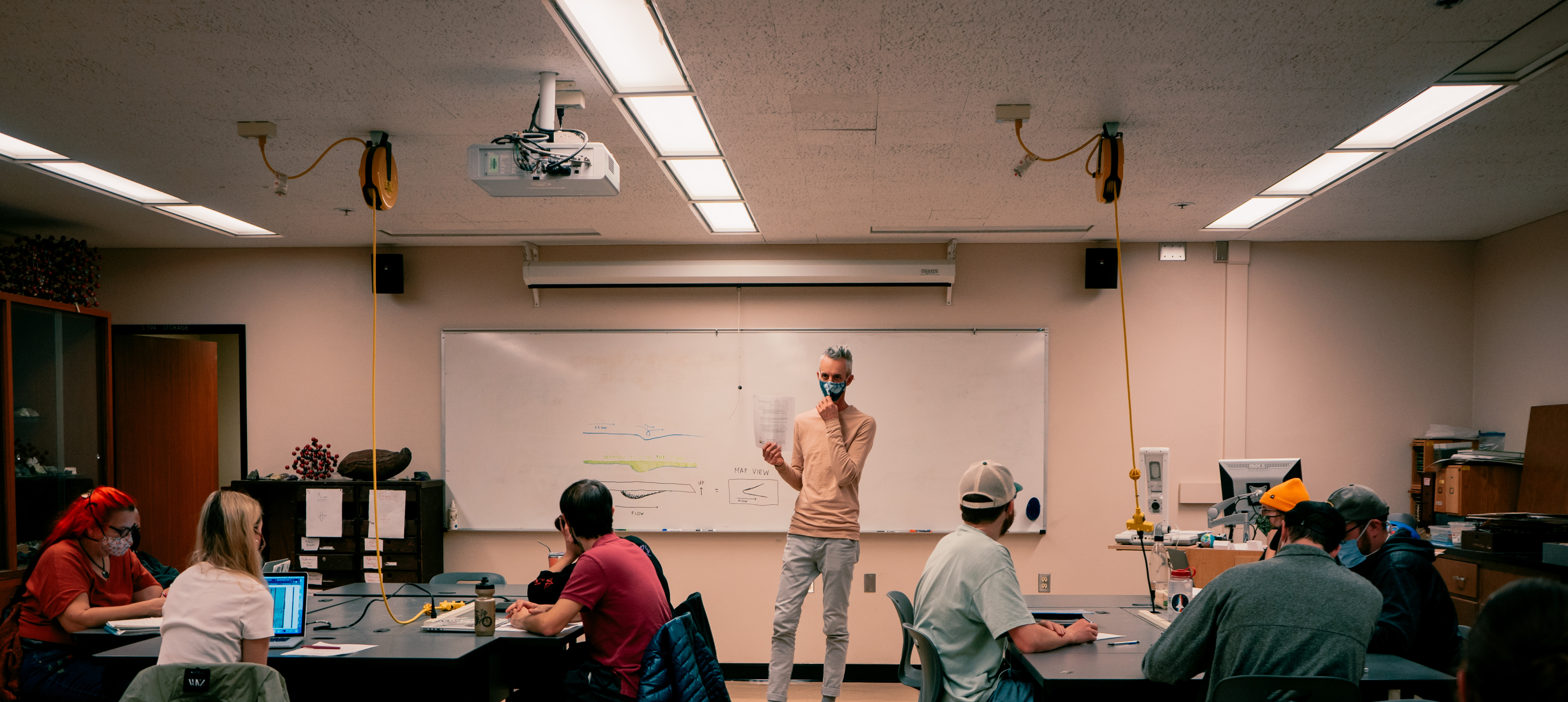 Geology class listening to instructor at front of room