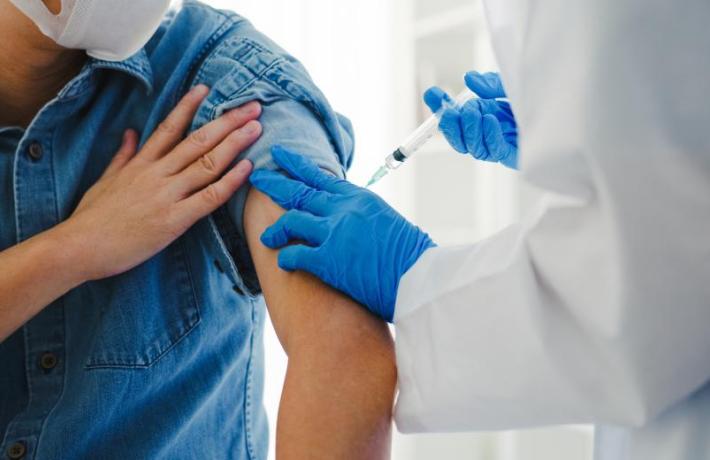 Close up of person getting vaccine