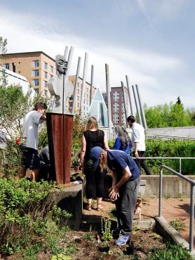 Class working on garden in Native American Center