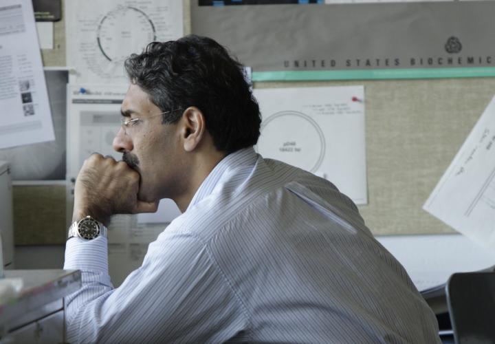 Professor sitting at desk