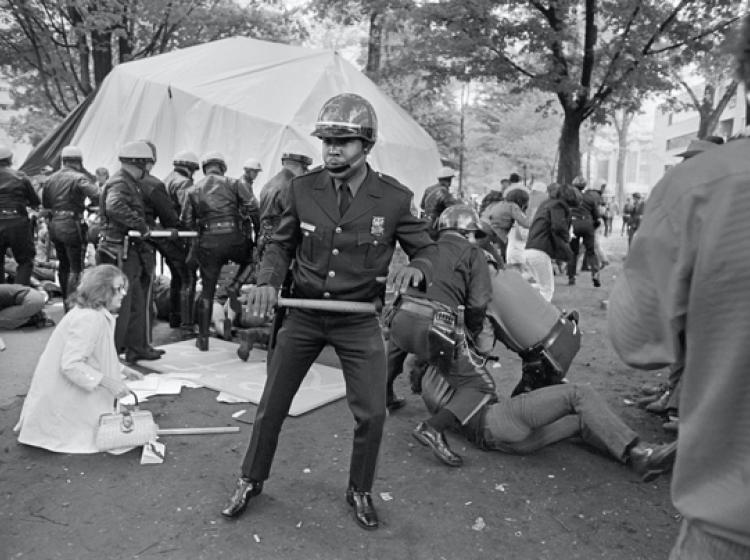 Officers beat protesters who refused to give way.