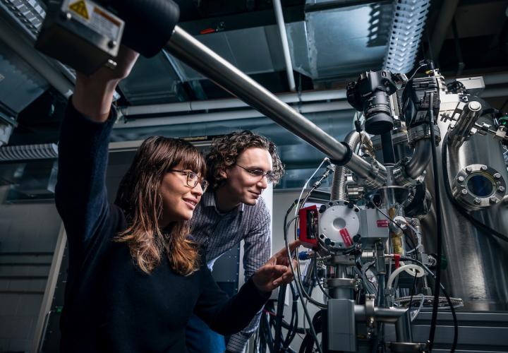 Two students engaged in research