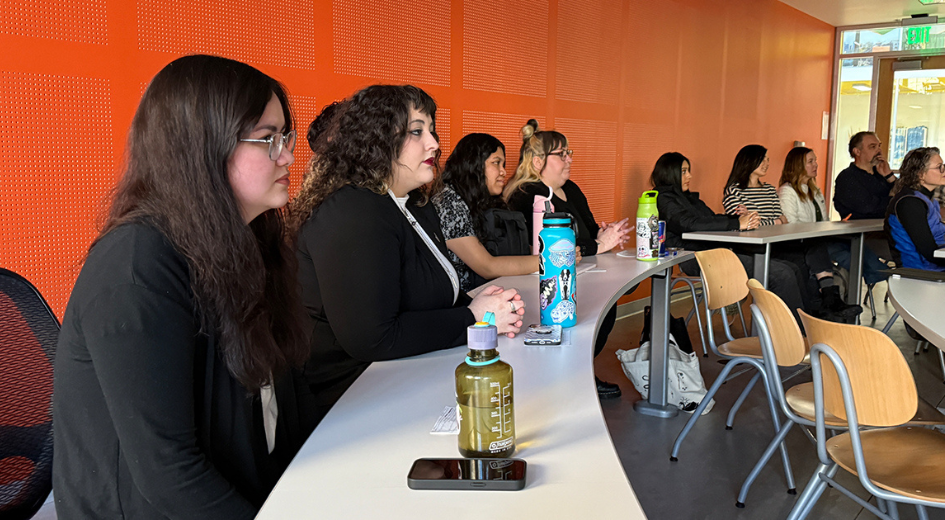 students watching team presentation