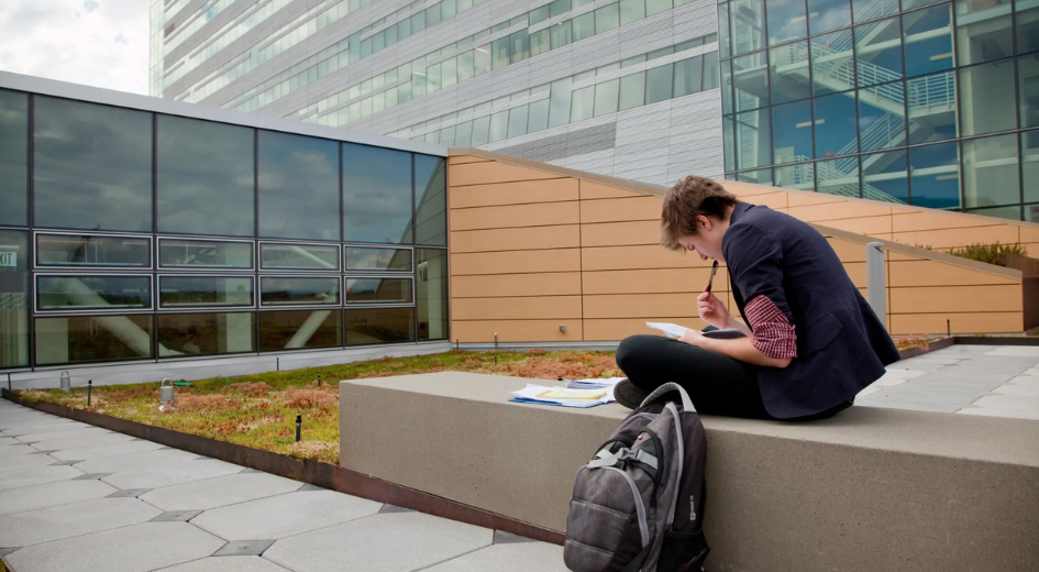 Student at Collaborative Life Science Building rooftop