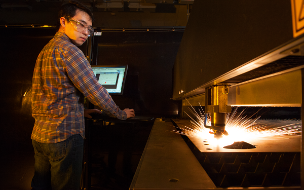 Student working with 600 watt laser